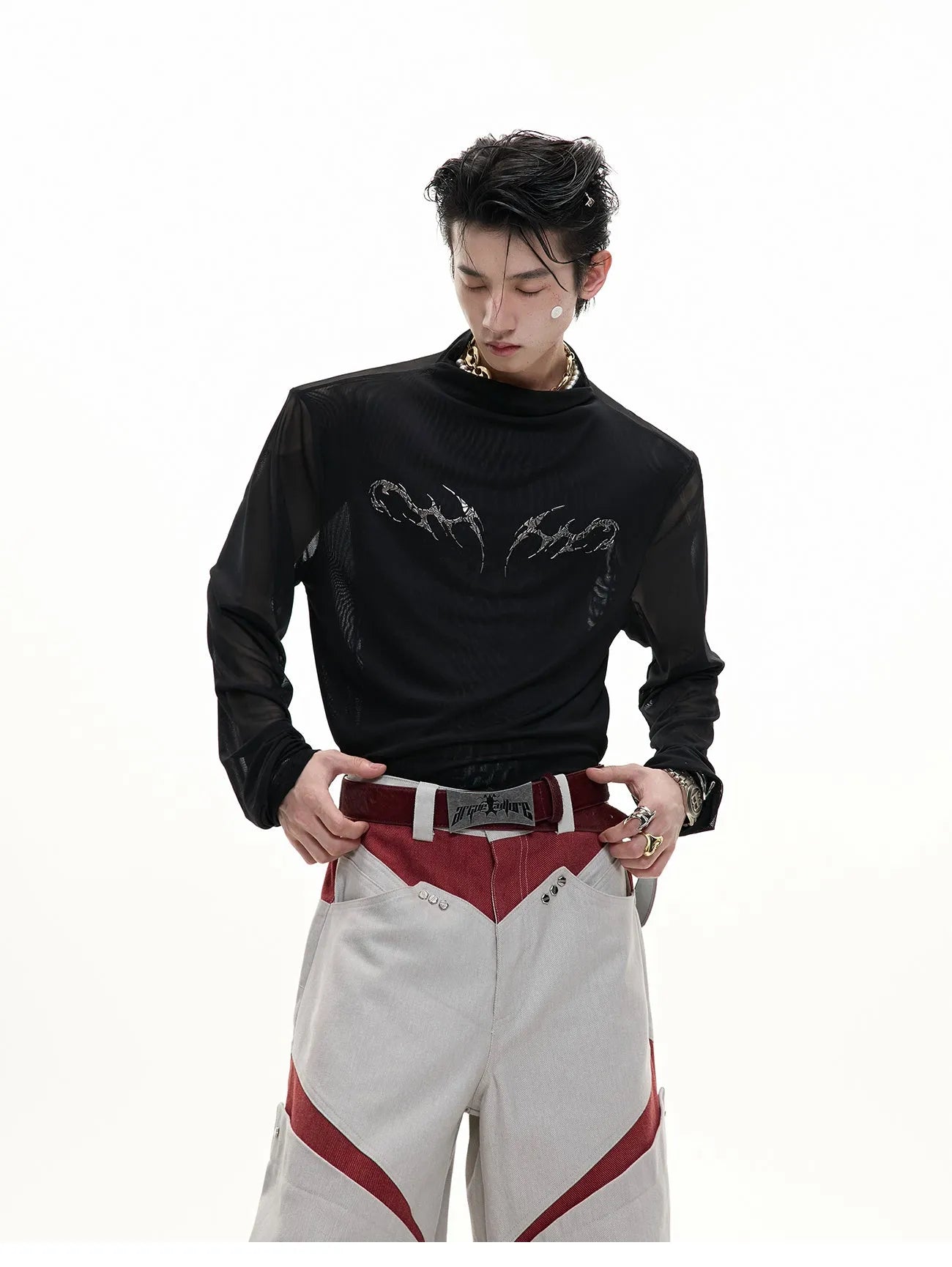 Black niche mesh slim-fit long sleeve bottoming shirt laid flat, showing trendy style and texture.