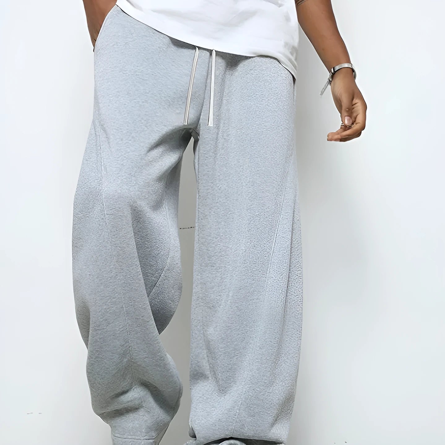 Men's straight-leg casual polyester trousers in black, shown with a drawstring waist.