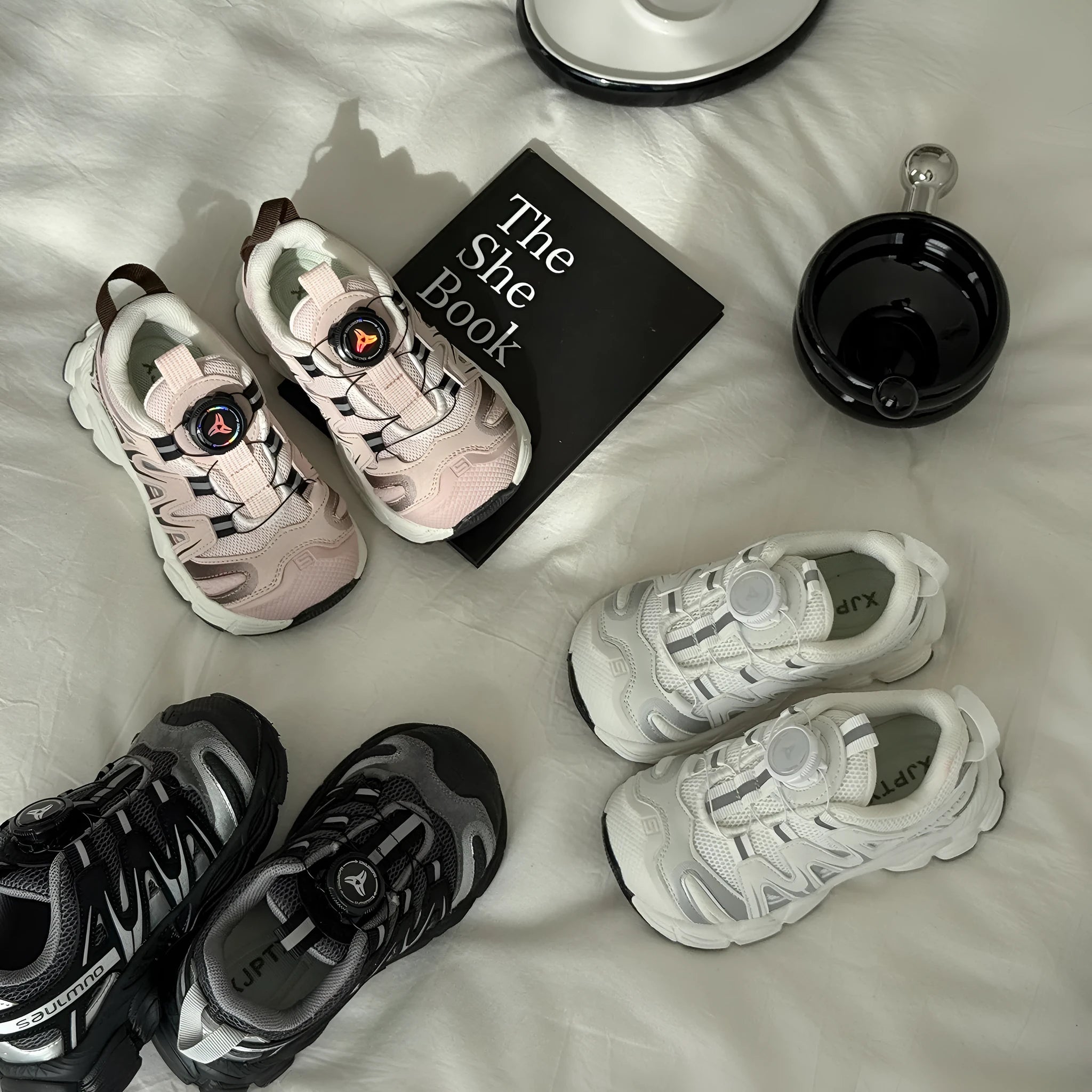 Girls lightweight casual sneaker in PU leather mesh, shown in solid black, beige, or pink.
