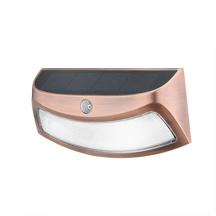 Solar-powered decorative wall lamp with smiling face design for outdoor garden lighting