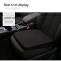 Black car seat cushion with thick foam padding measuring approximately 42cm by 39cm