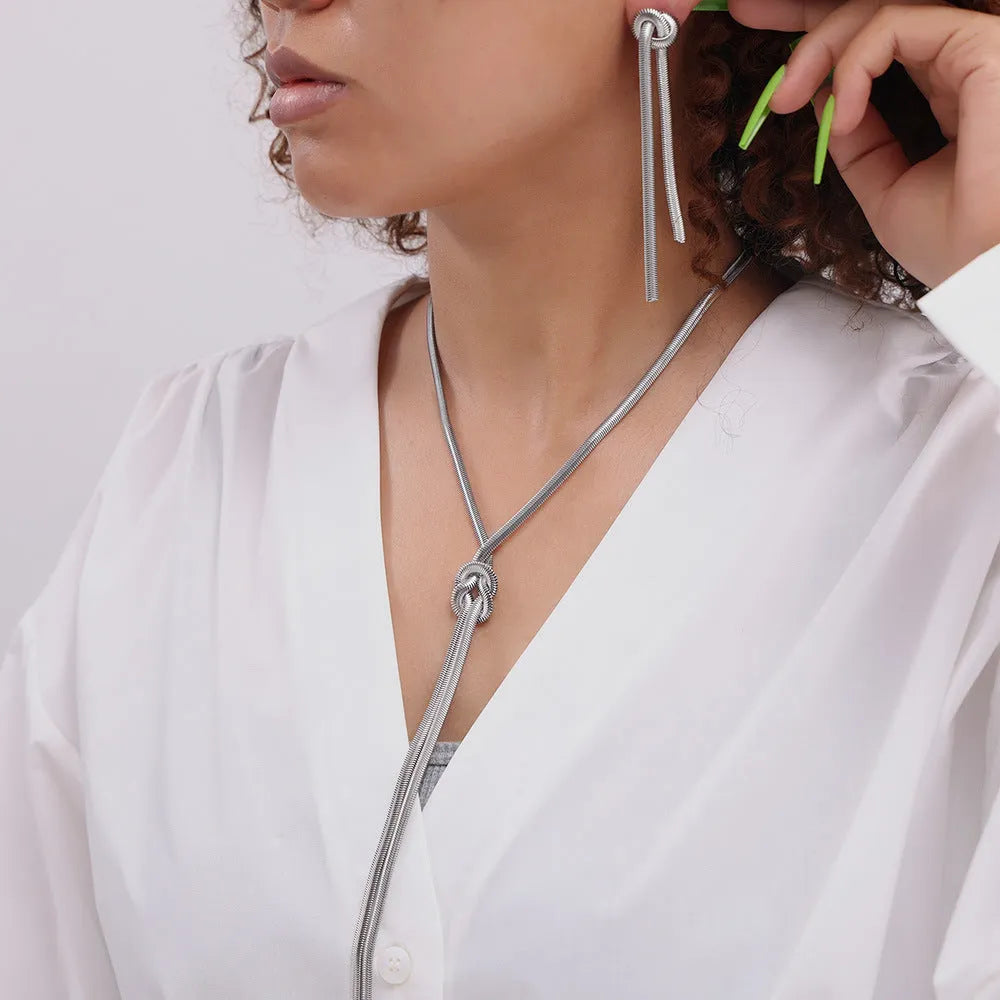 Gold electroplated titanium steel necklace with snake chain and tassel pendant with matching earrings jewellery set