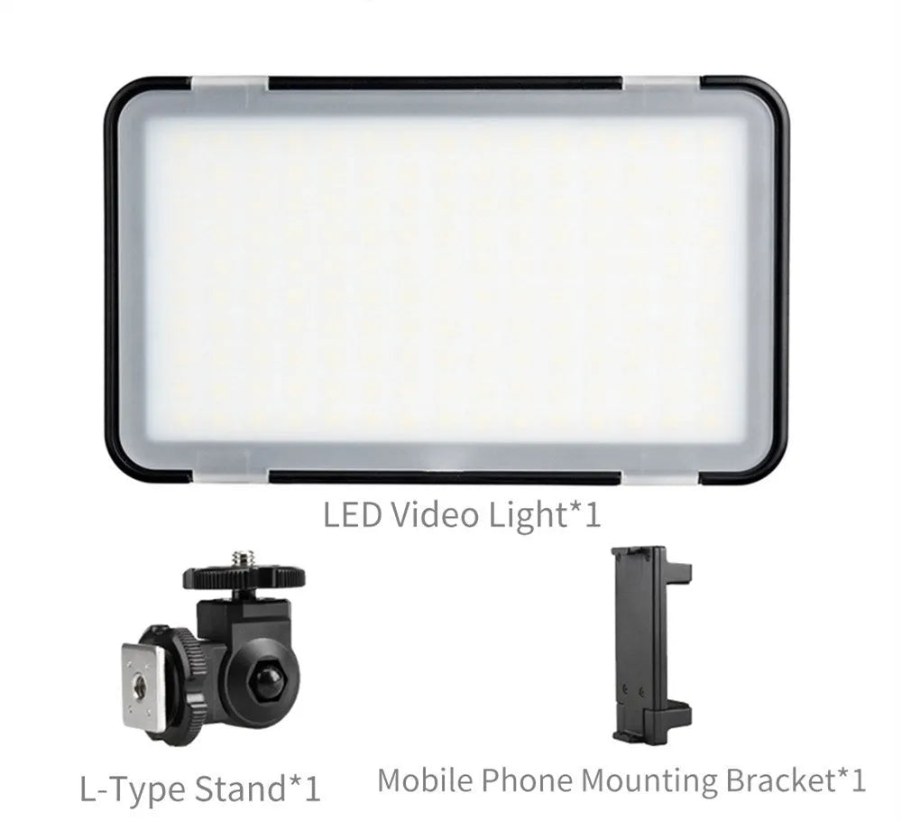 Slim silver Shenniu M150 LED video light with bracket on a mobile phone.