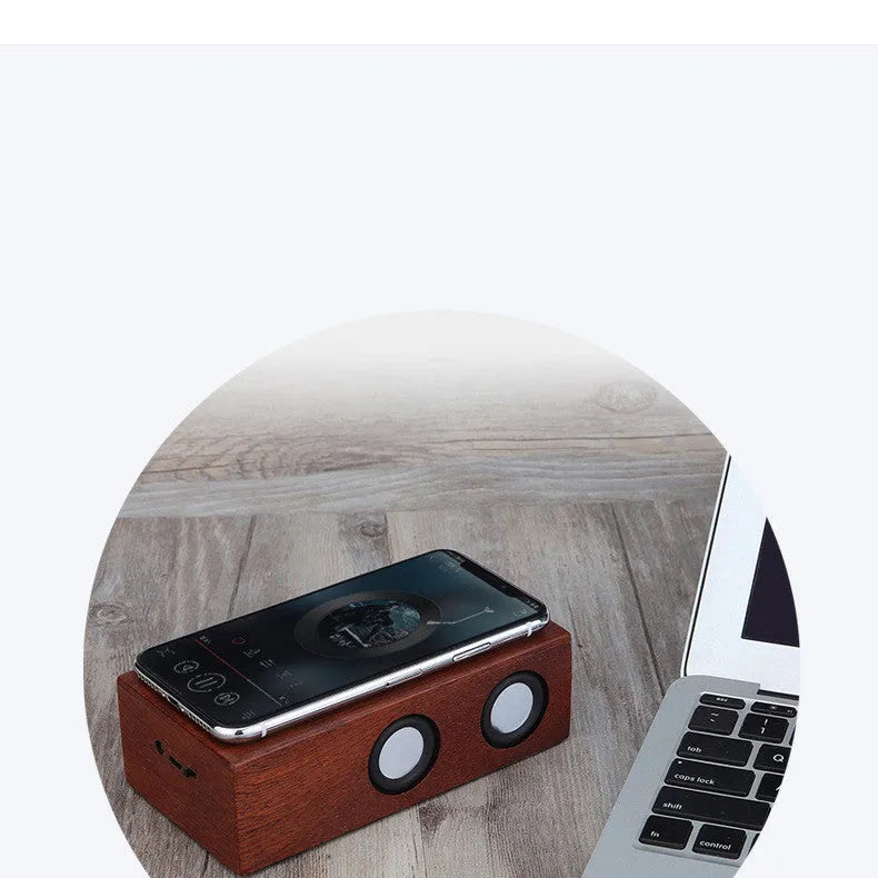 Wooden Bluetooth speaker in bamboo, black walnut, or sapele finish with 7-hour battery.