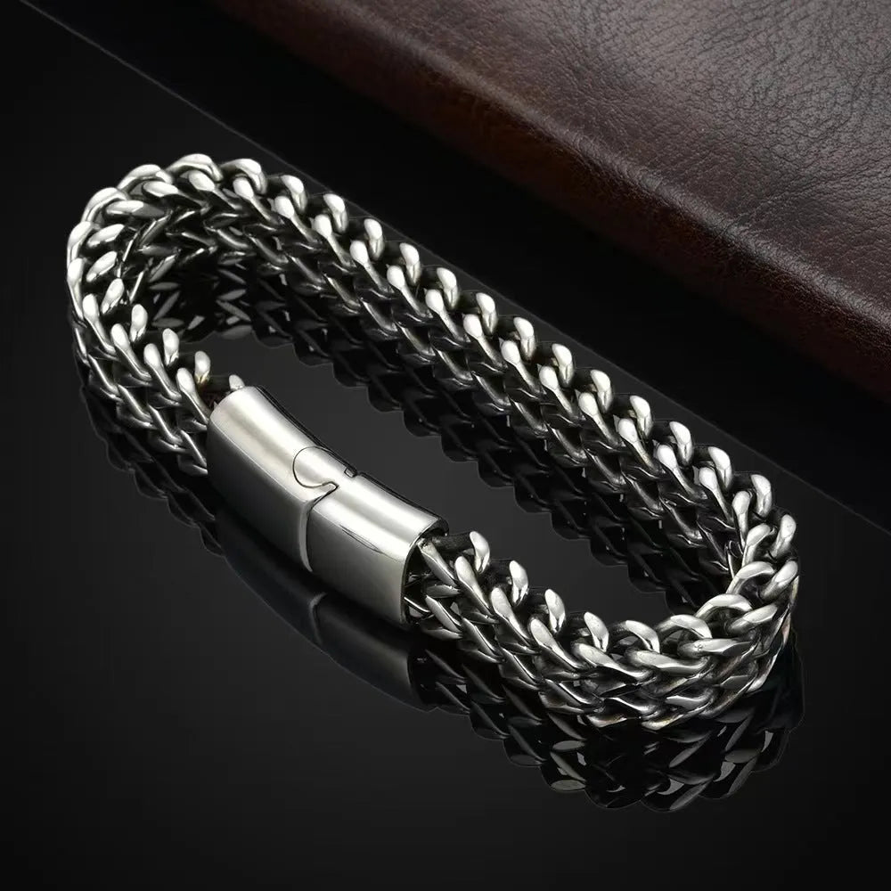 Geometric titanium steel unisex bracelet in silver showing simple front and back design.