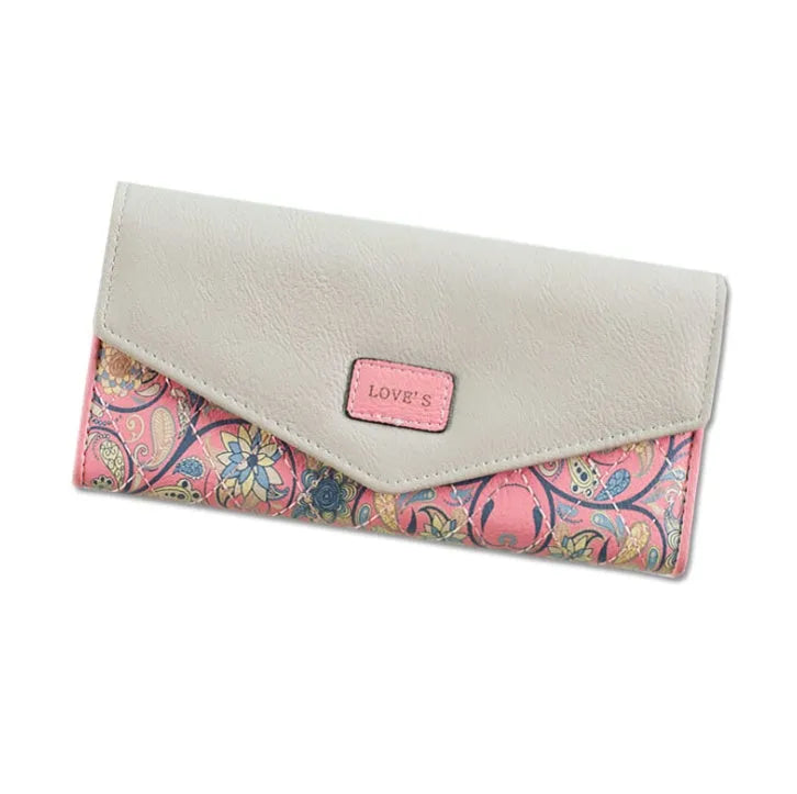 Women's black PU leather three-fold wallet with a buckle fastener, showing card slots and note compartment.