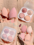 Four makeup egg sponges in grape, mango, mint, and peach peach colours, each approximately 6cm long