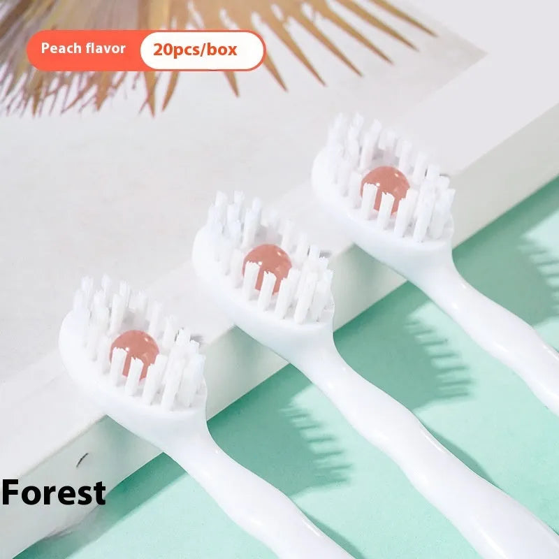 Box containing 20 individual pre-pasted bead toothbrushes for travel, shown with mint, peach, and green tea flavour options.