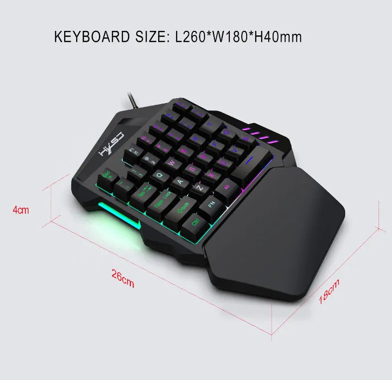 V100 one-handed black mini keyboard and mouse set on a desk
