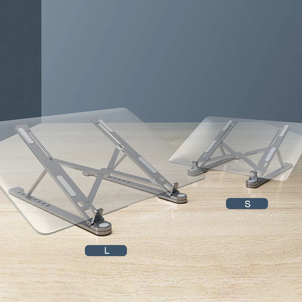 Silver foldable aluminium laptop stand holding a MacBook at an adjustable angle.