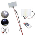 White LED fishing rod light unit on a tall telescopic pole with a remote control, for outdoor night use.