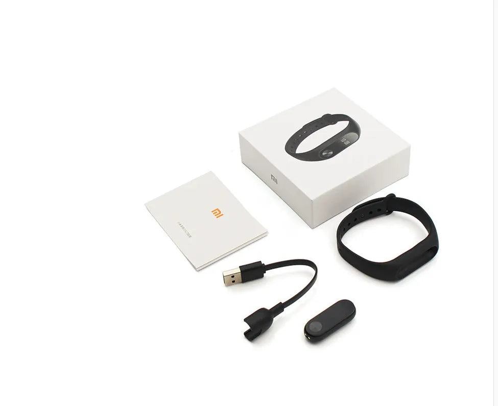 Xiaomi Mi Band 2 black fitness tracker with OLED display showing heart rate reading