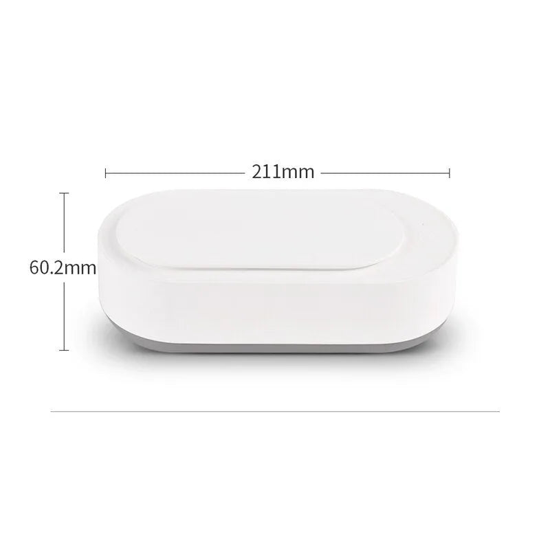 White portable ultrasonic cleaning machine with stainless steel tank for jewellery and glasses.