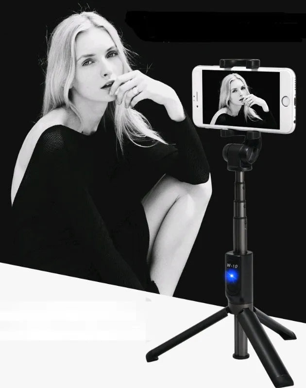 Black Bluetooth selfie stick with tripod bracket extended showing phone clamp and remote control