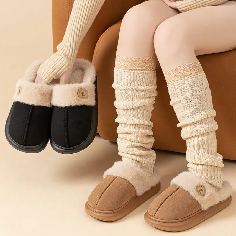 Pair of fleece slippers with a car stitch design and PVC sole, shown in one of five colour options.
