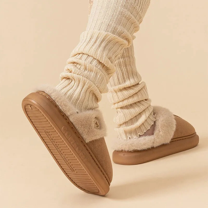 Pair of fleece slippers with a car stitch design and PVC sole, shown in one of five colour options.