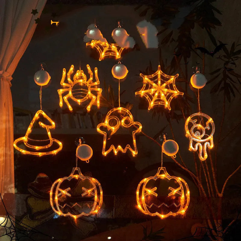 Halloween window hanging LED lights 7-piece set with spider pumpkin ghost designs on display