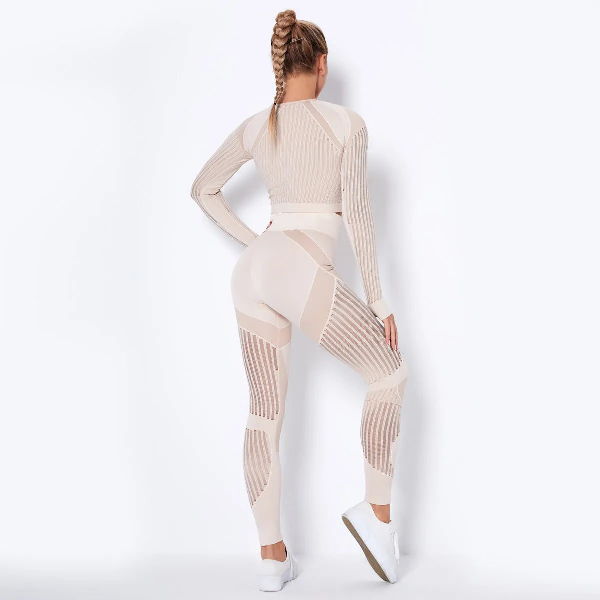 Women's seamless knitted long sleeve yoga wearsuit in a striped pattern, shown in a neutral colour.