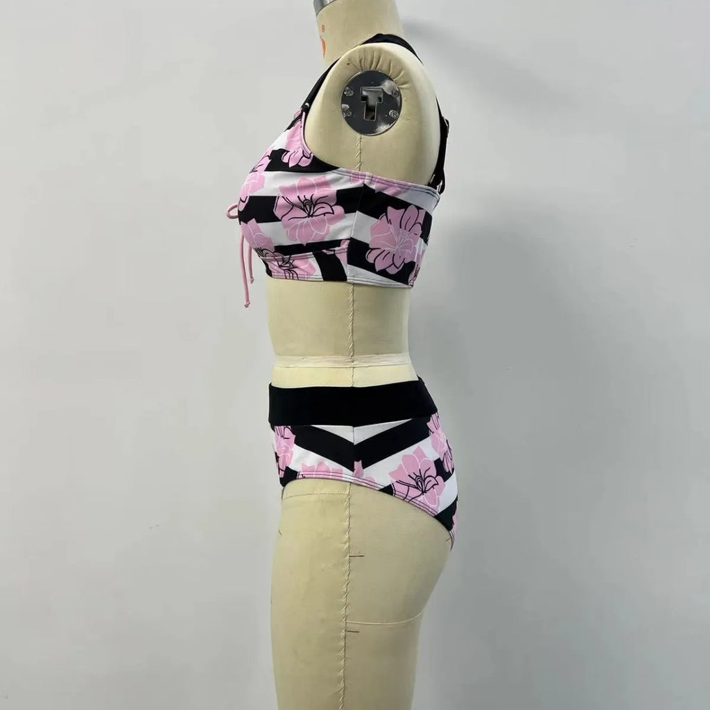 Black women's printed bikini set with belly-covered slimming design for swimming.