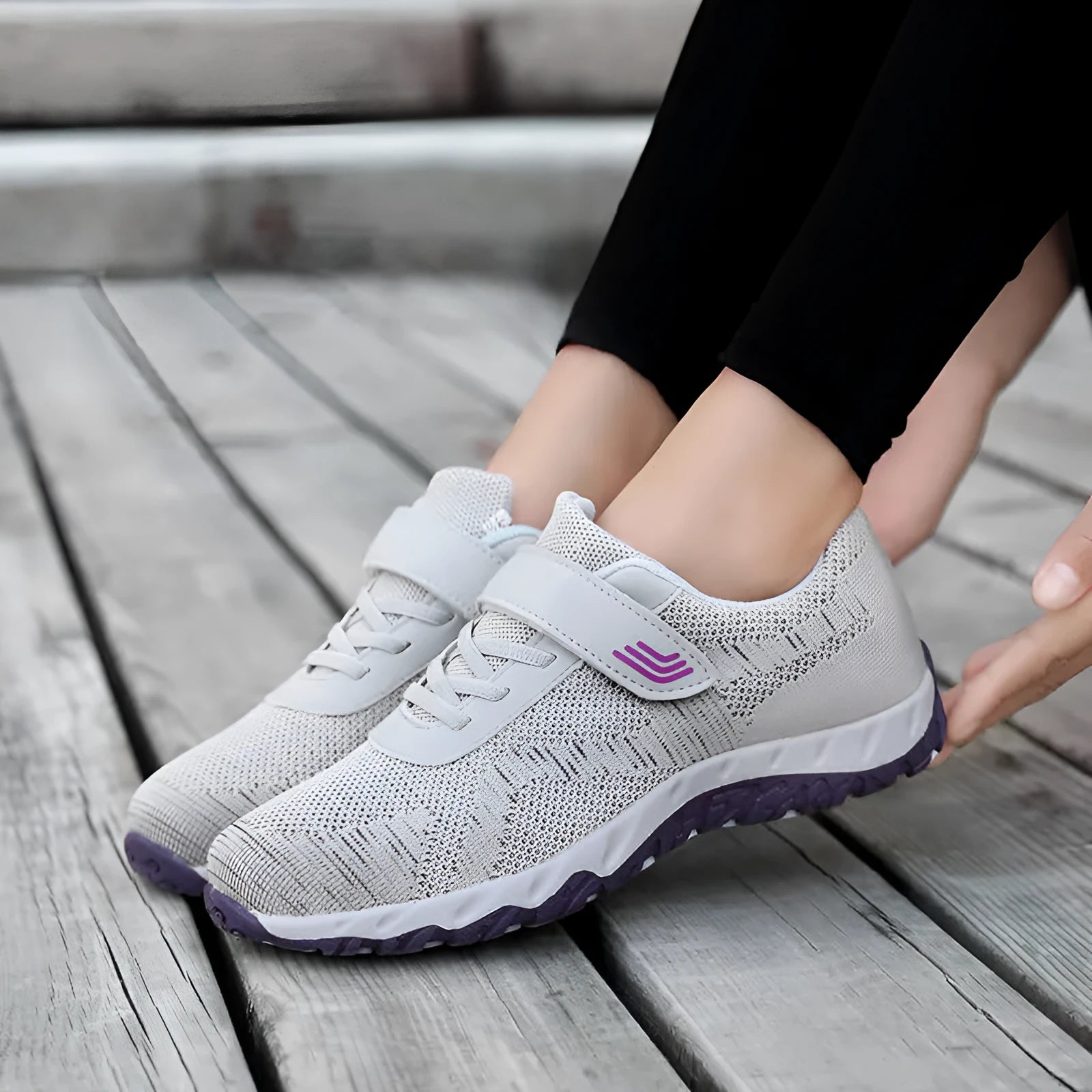 Women's grey purple breathable mesh shoes with a velcro strap and wedge heel on a composite sole.