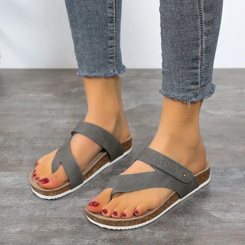 Women's flat toe ring flip-flops with a thick foam sole, shown in a solid colour.