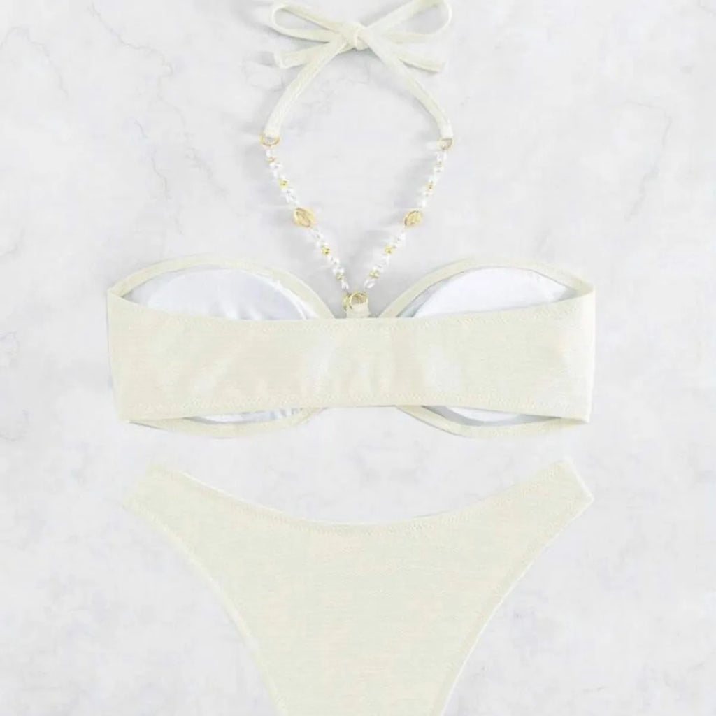 Women's halter neck bikini set in solid colour with brief bottoms for beach swimming