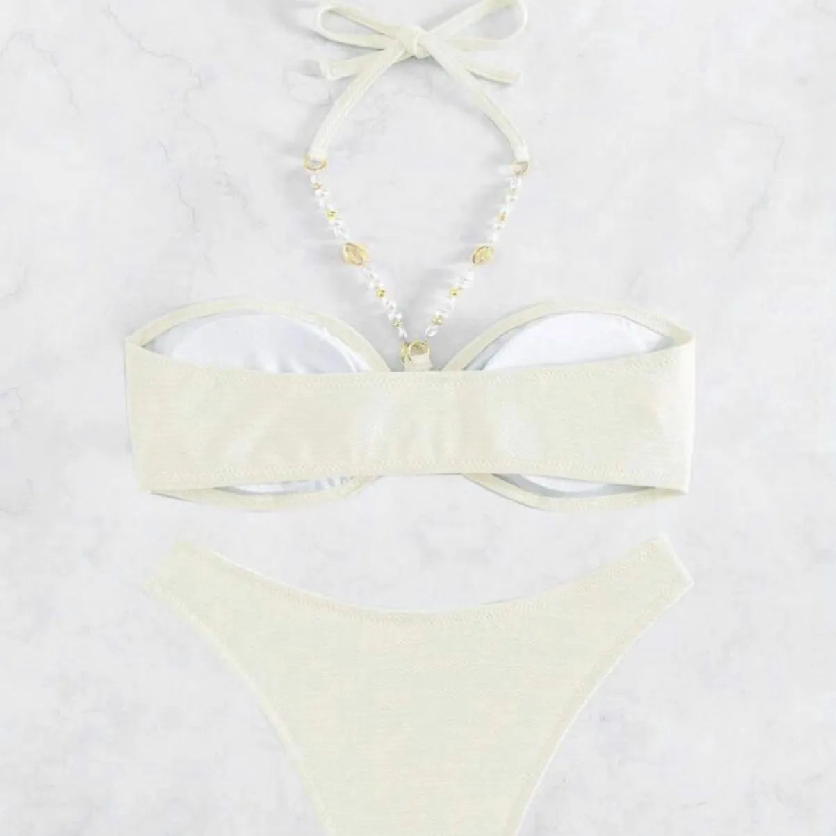 Women's halter neck bikini set in solid colour with brief bottoms for beach swimming