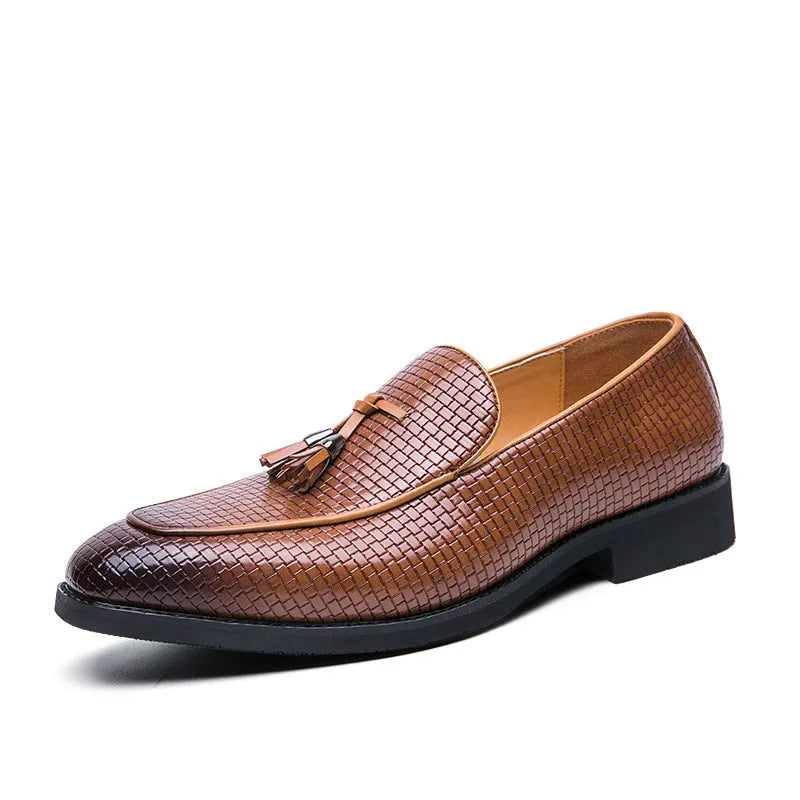 Men's black pointed slip-on shoes with a tassel detail on the front, made from artificial PU.