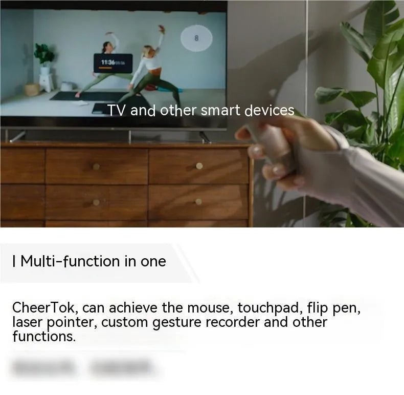 Silver wireless presenter with laser pointer and remote control on table