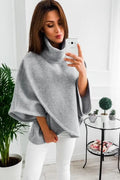 Women's long black batwing sleeve cardigan with plush fleece fabric on a hanger.