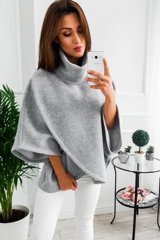 Women's long black batwing sleeve cardigan with plush fleece fabric on a hanger.