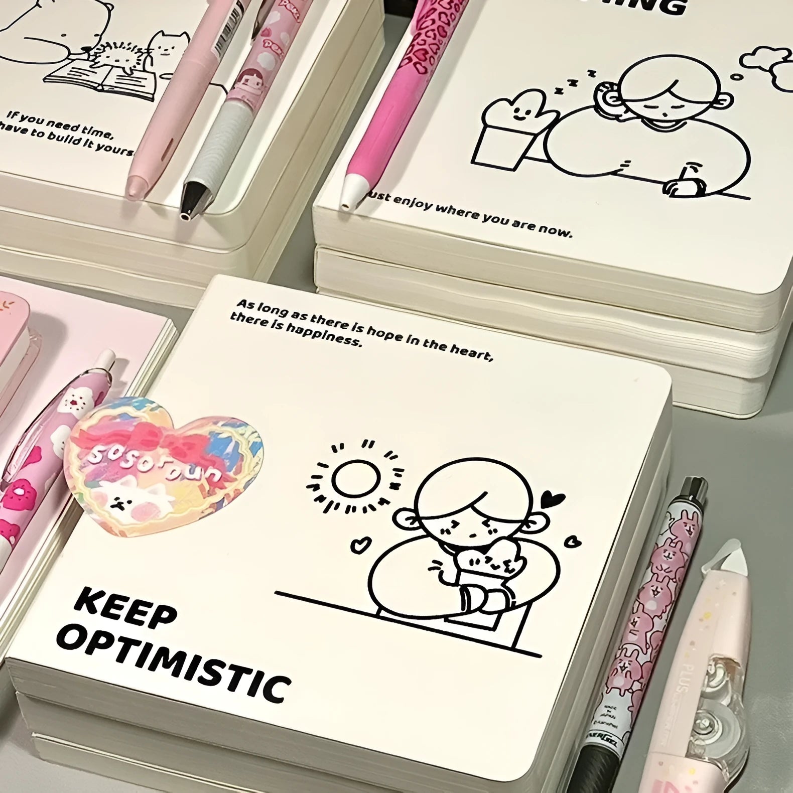 Square paper diary notebook with heart design, checkered pages, and included stickers