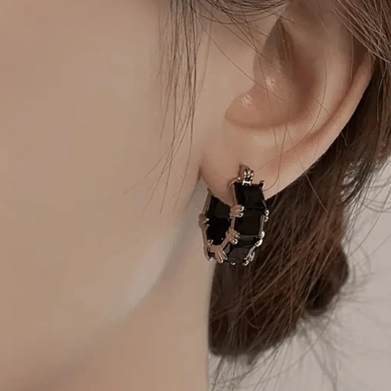 Geometric U-shaped women's earrings with round zircon elements in black, white or pink options