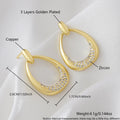 Women's yellow gold geometric drop-shaped earrings with ring design and zircon accents on a white background.