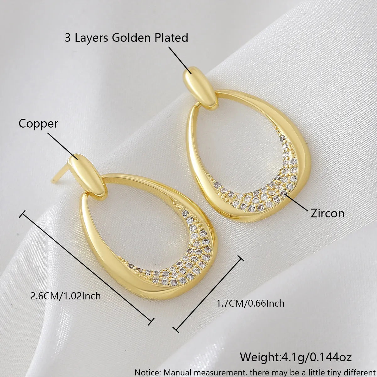 Women's yellow gold geometric drop-shaped earrings with ring design and zircon accents on a white background.