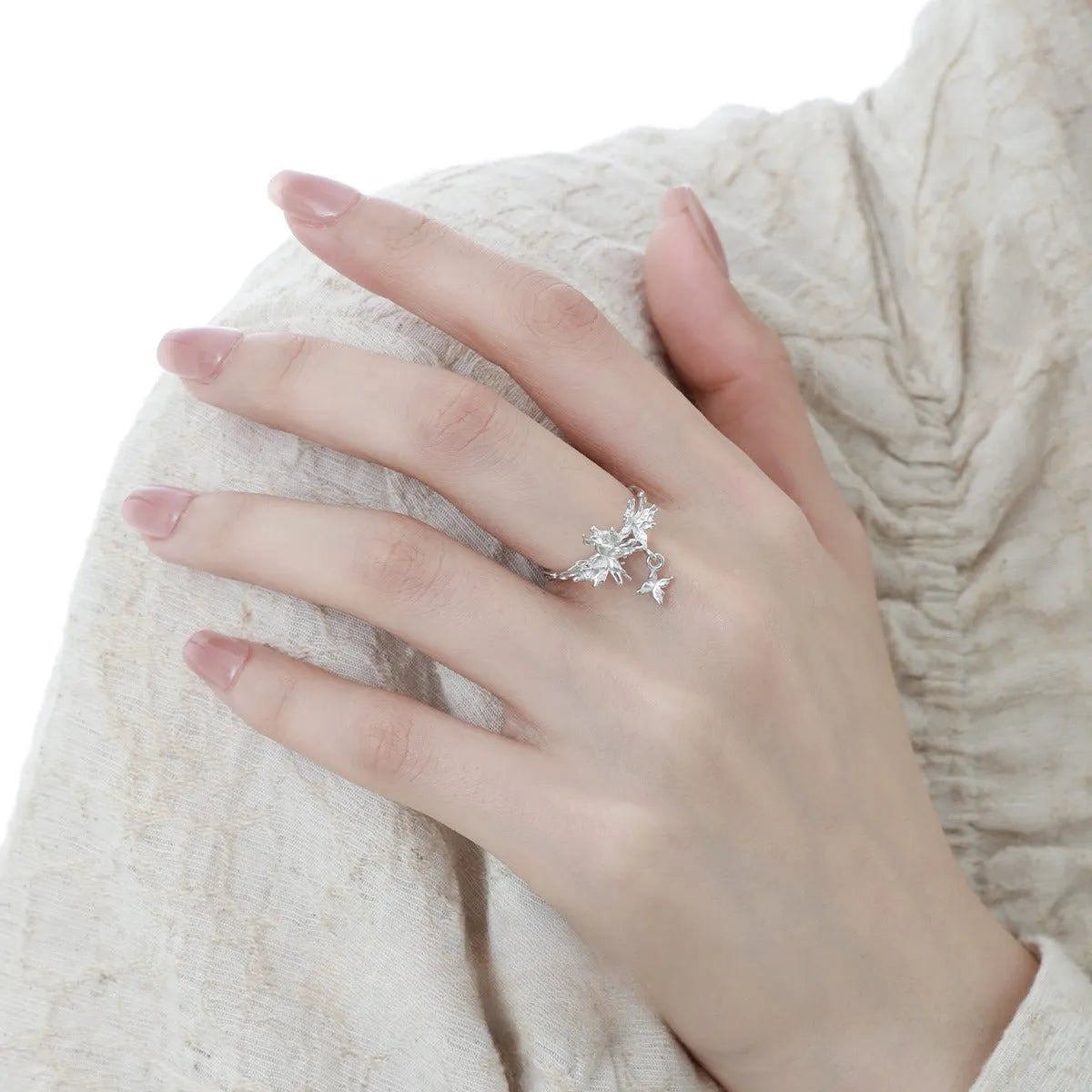 Adjustable silver butterfly ring showing electroplated finish in either white gold or 18K gold colour option.