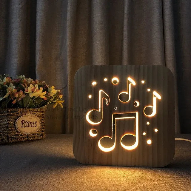 Square pine wood USB LED lamp with warm white light on a desk.