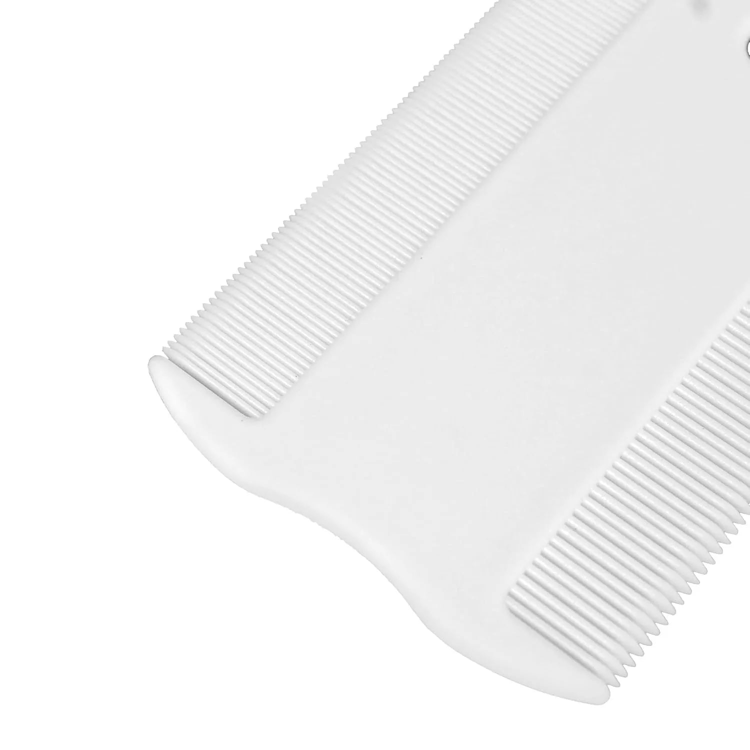 Small white plastic flea comb for pets with double-sided dense teeth, shown next to a ruler for scale.