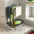 Foldable white plastic kitchen draining rack in a Chinese style, shown both wall-mounted and on a countertop.