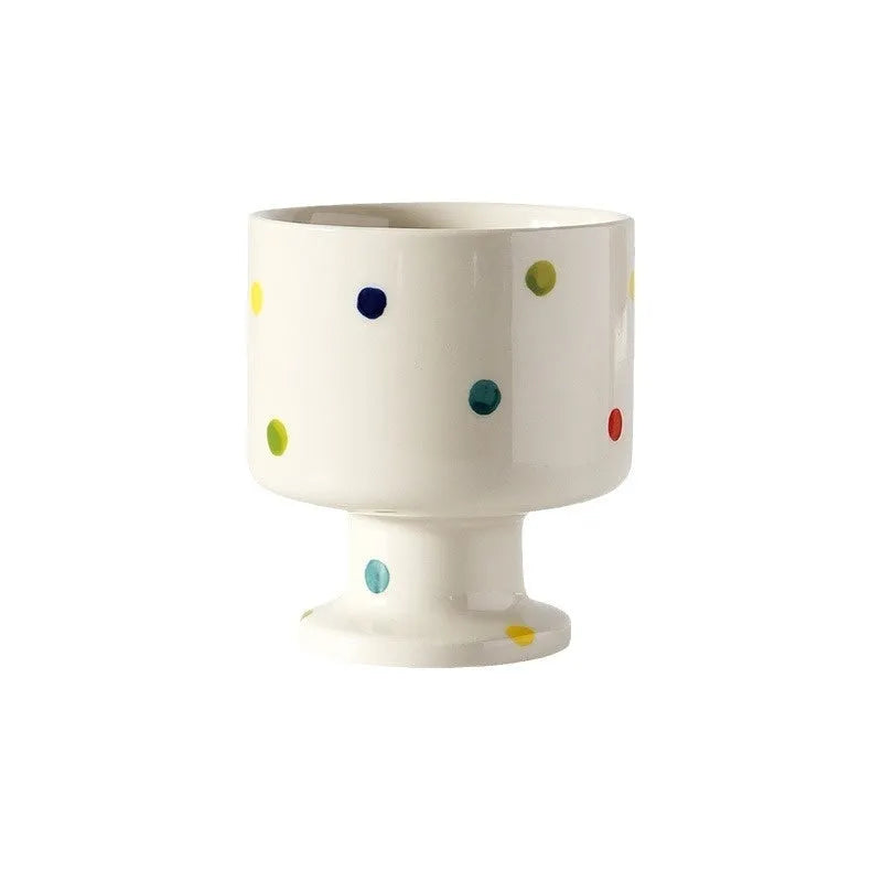 Hand-pinched ceramic mug with irregular shape and solid-colour finish, approximately 14.5cm tall