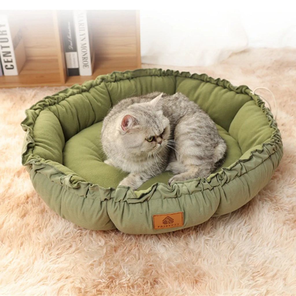 Grey and green reversible donut cat bed shown in small, medium, and large sizes
