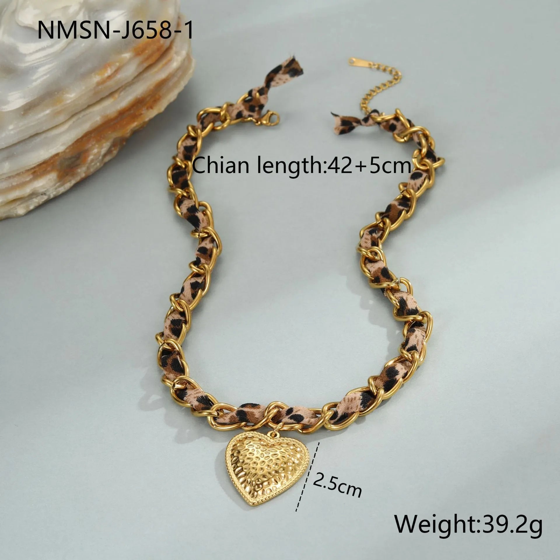 Gold plated leopard print stainless steel necklace with big heart or love sun pendant on a chain.