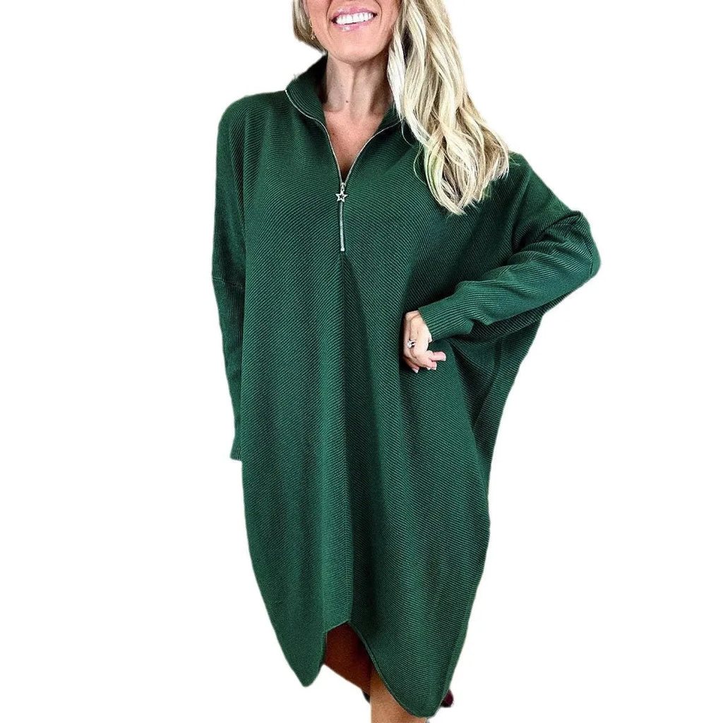 Women's solid colour knitted loose dress with zip and raglan sleeves, shown in dark green.