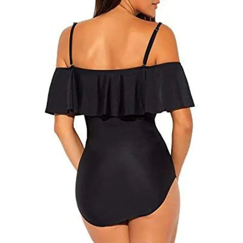 Black one-piece swimsuit with cut-out design and ruffled straps on the tube top