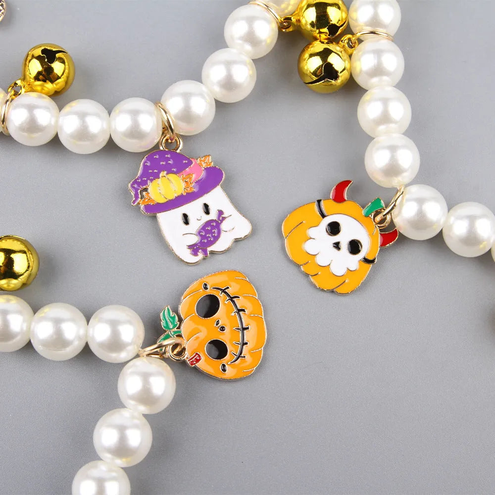 Halloween decorative pet collar with simulated pearls and a pumpkin charm.