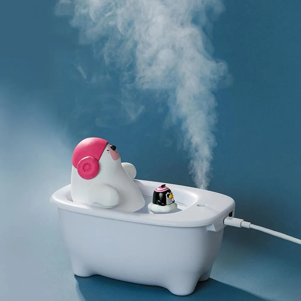 White USB air humidifier with large water tank on a desk.