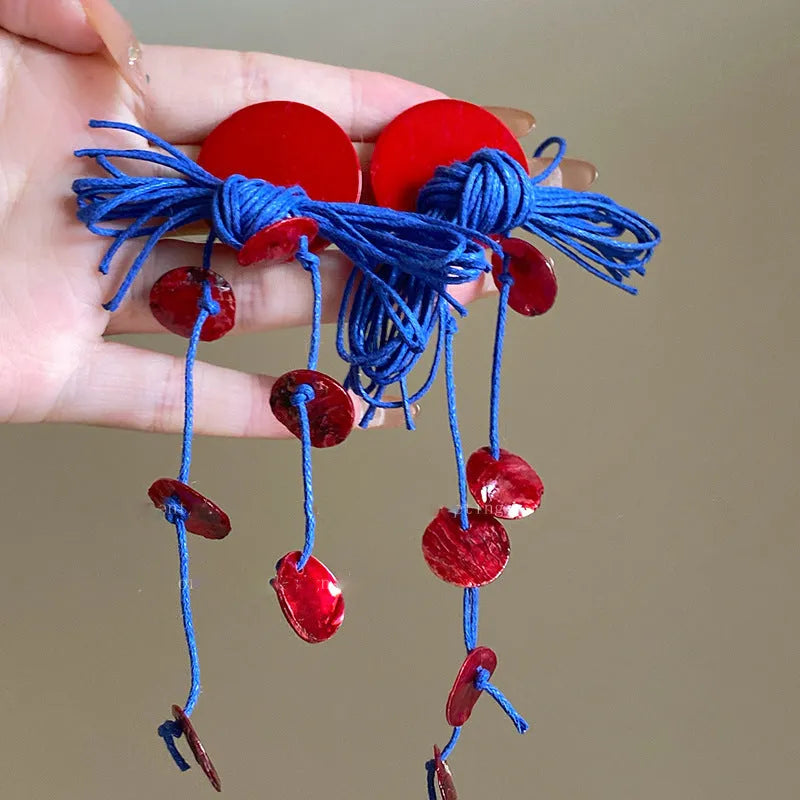 Women's geometric fabric earrings with blue resin flower detailing and silver needle colour