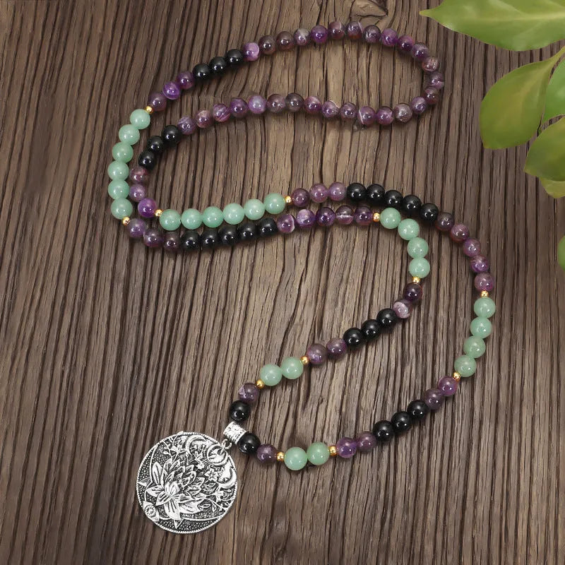 Handmade stone bead necklace with geometric alloy lotus pendant and matching adjustable bracelet.