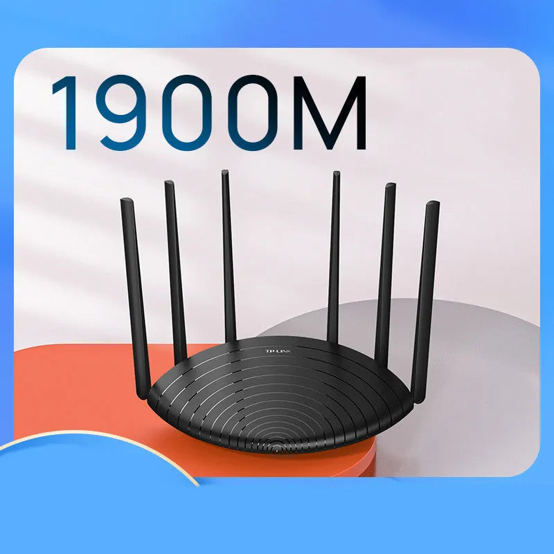 TP-Link TL-WDR7661 black AC1900 gigabit wireless router with antennas on a desk.