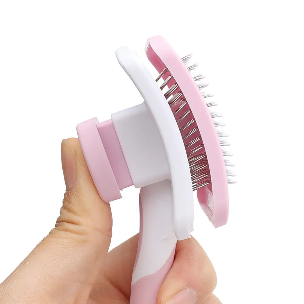 Self-cleaning slicker brush for dogs and cats with one-click hair removal button, available in green, orange, and pink